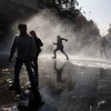 Wasserwerfer zum 1. Mai in Santiago, Chile (Keystone/AP Photo/Luis Hidalgo)